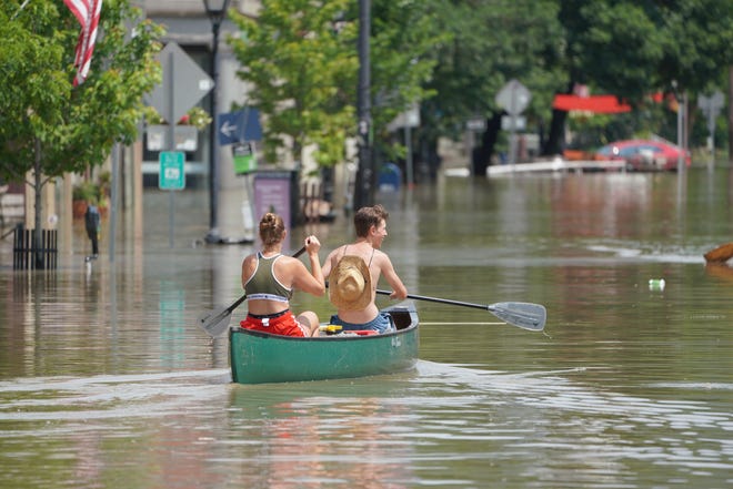 Floodwaters Shut Down Cars And Damaged Shops In Downtown Montpelier, Vermont, Tuesday, July 11, 2010, As Heavy Rains Swept Through The Area And Forced Rivers To Overflow Their Banks.